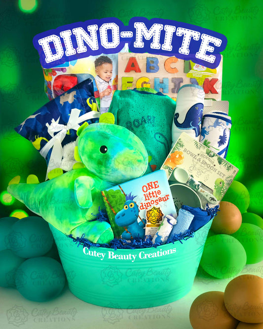A colorful gift basket containing a green dinosaur plush toy, a children's book, ABC letter blocks, and various baby essentials, arranged against a dinosaur-themed backdrop.