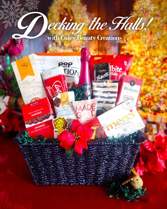 Gift basket with snacks and a bottle of wine on a festive background with text 'Decking the Halls! with Cutey Beauty Creations'.