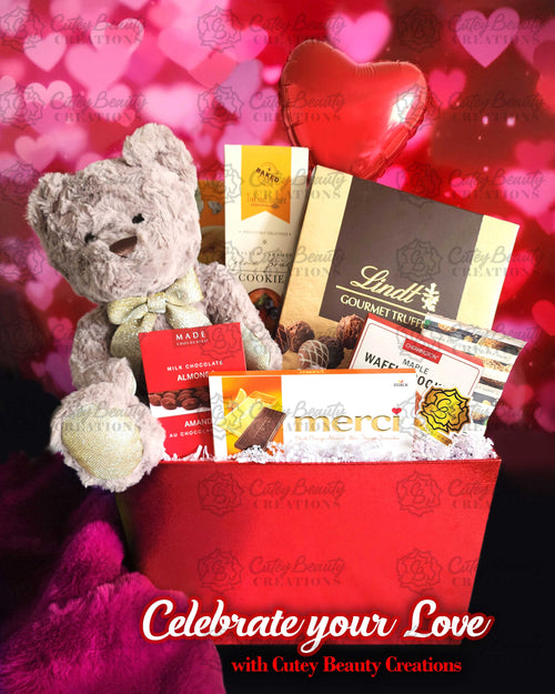 A Valentine's Day themed gift basket containing a plush teddy bear, chocolates, and cookies, with 'Celebrate Your Love' text and the logo of Cute Beauty Creations.